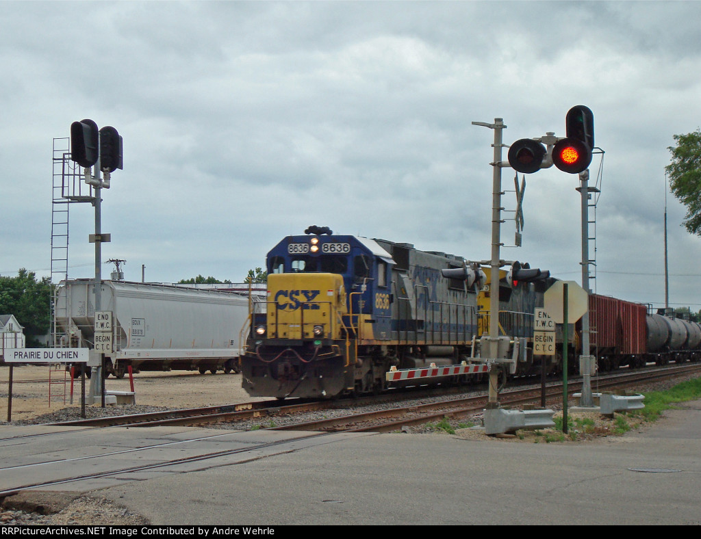 CSXT 8636 WB on the BNSF, passing the station sign